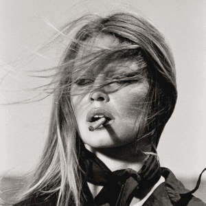 Terry O'Neill - BRIGITTE BARDOT SMOKING CIGAR, 1971